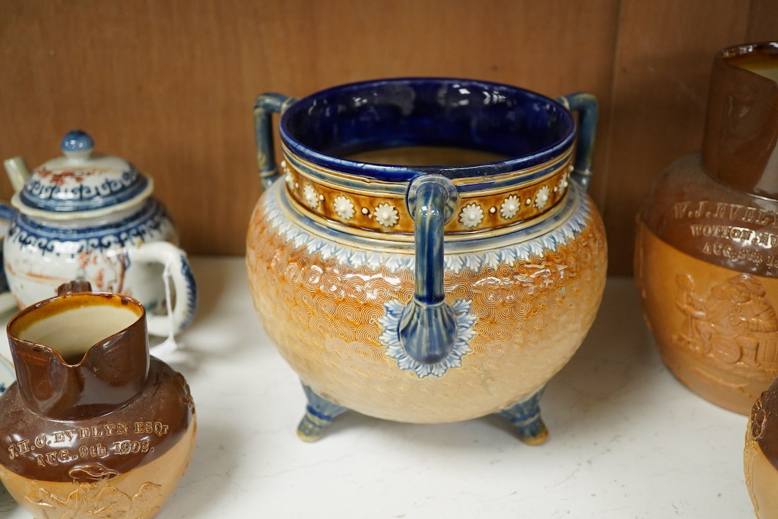 Four graduated Royal Doulton harvest jugs and a Royal Doulton Lambeth three footed jardiniere- 17cm high